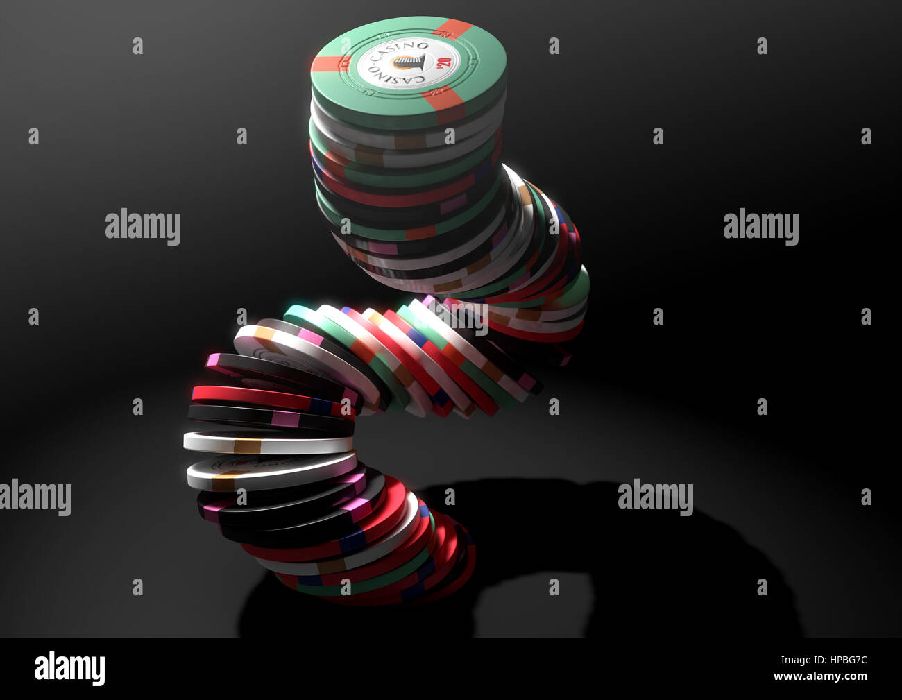 A falling stack of various values of casino chips on an isolated black