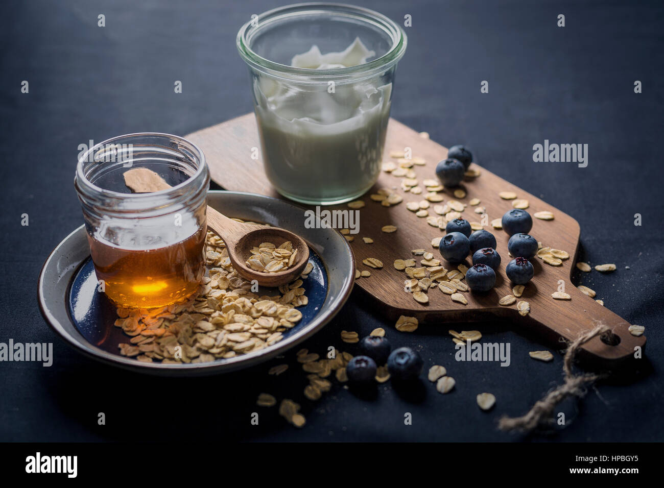 Greek yogurt with bueberries, oats and honey Stock Photo Alamy
