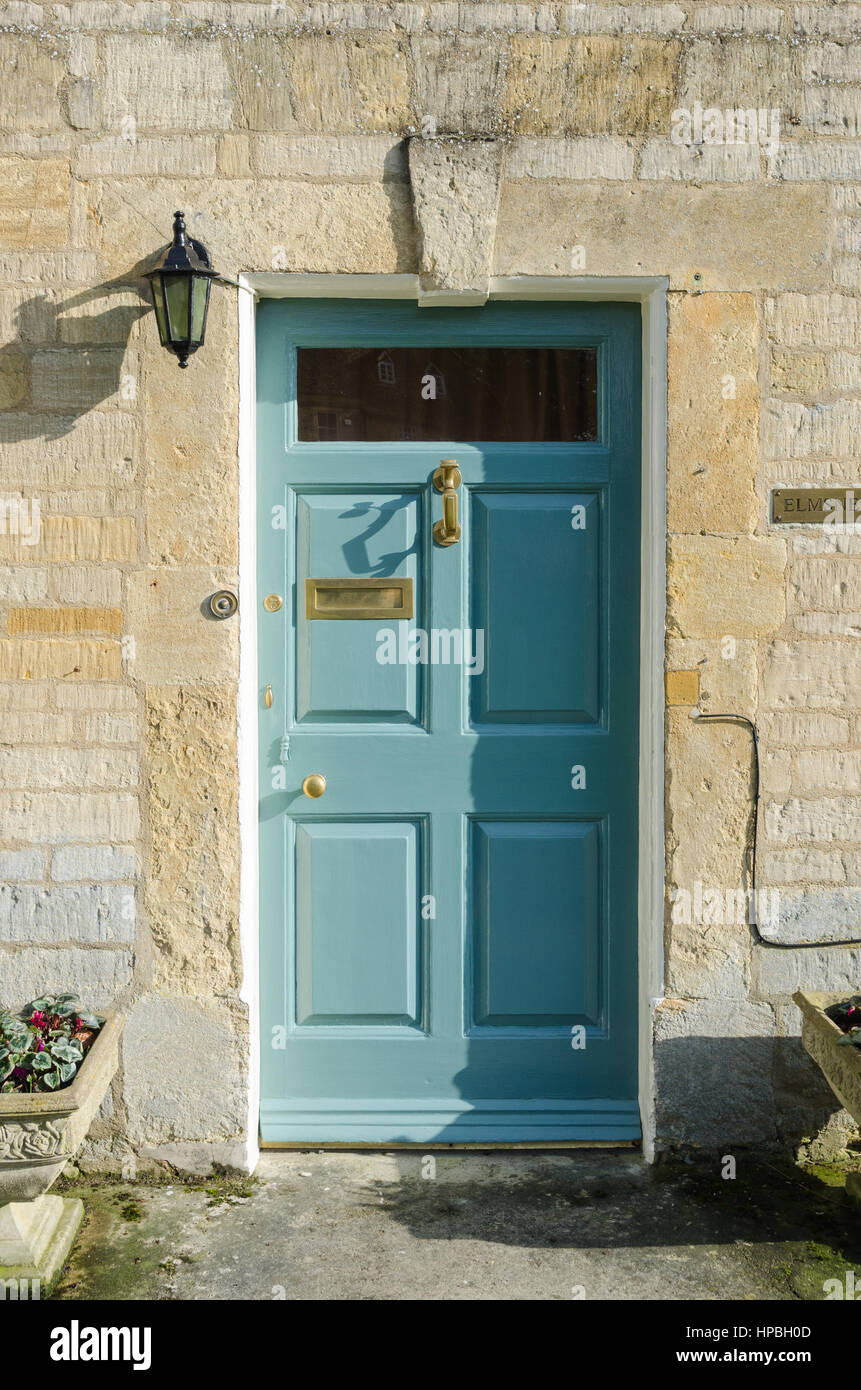 Traditional light blue wooden front door in Stow-on-the-Wold in the Cotswolds Stock Photo