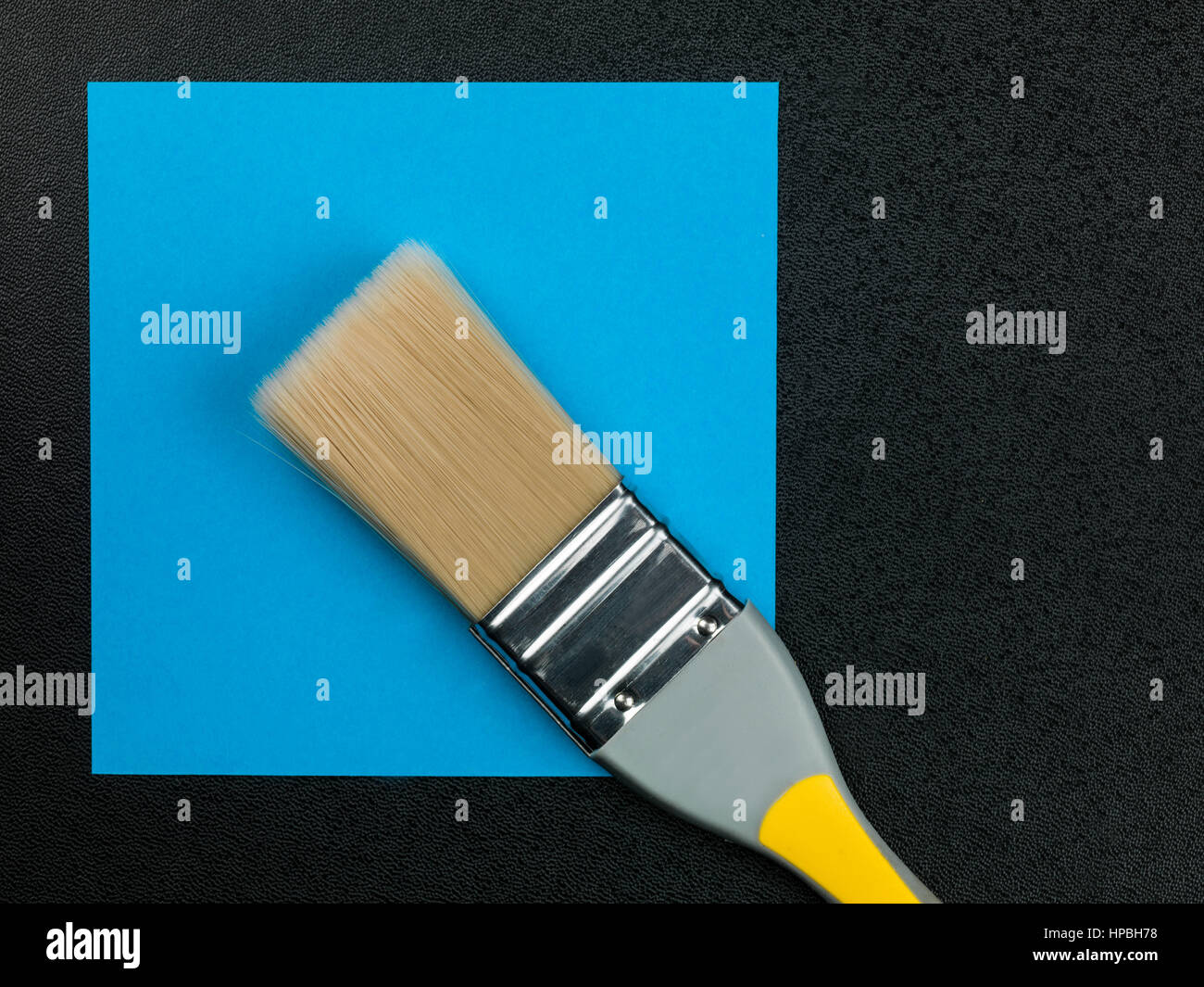 Paintbrush on a Blue Background With Copy Space Stock Photo - Alamy