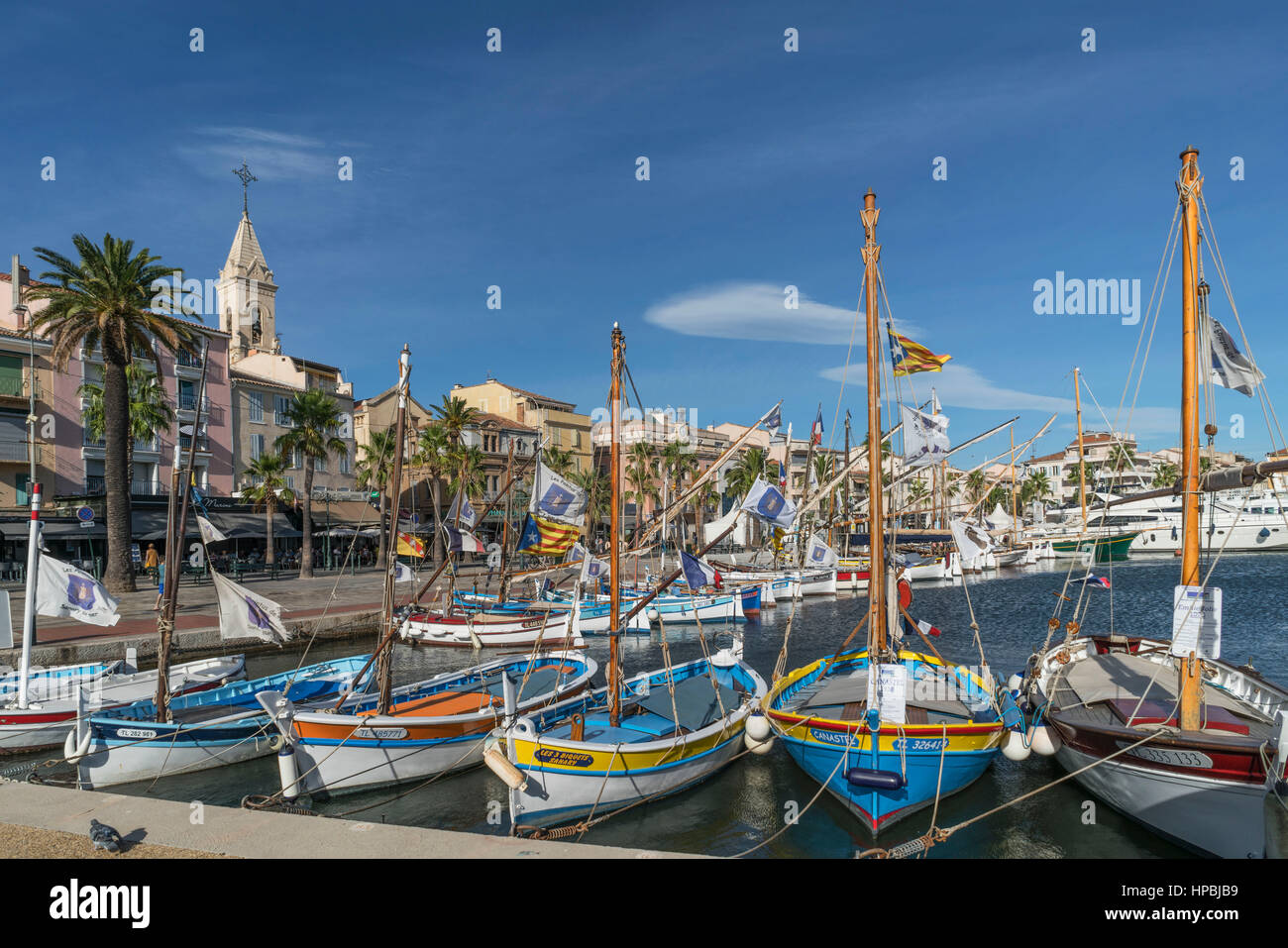 Mediterranean Fishing boats at Sanary-Sur-Mer , Promenade, Mistral Clouds, French Riviera,  Cote d Azur, France Stock Photo