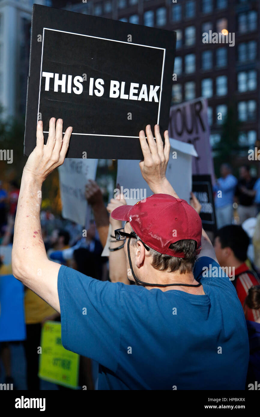 A protester holds a sign outside of the Republican National Convention on July 21, 2016. Cleveland, Ohio, United States. Stock Photo