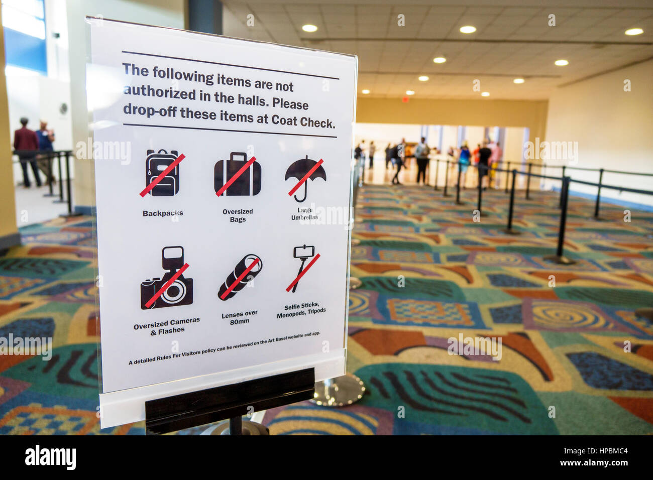 Miami Beach Florida,Convention Center,interior inside,Coat Check,sign,prohibited items,rules,no backpacks,oversize camera,lens,selfie stick,bags,FL161 Stock Photo
