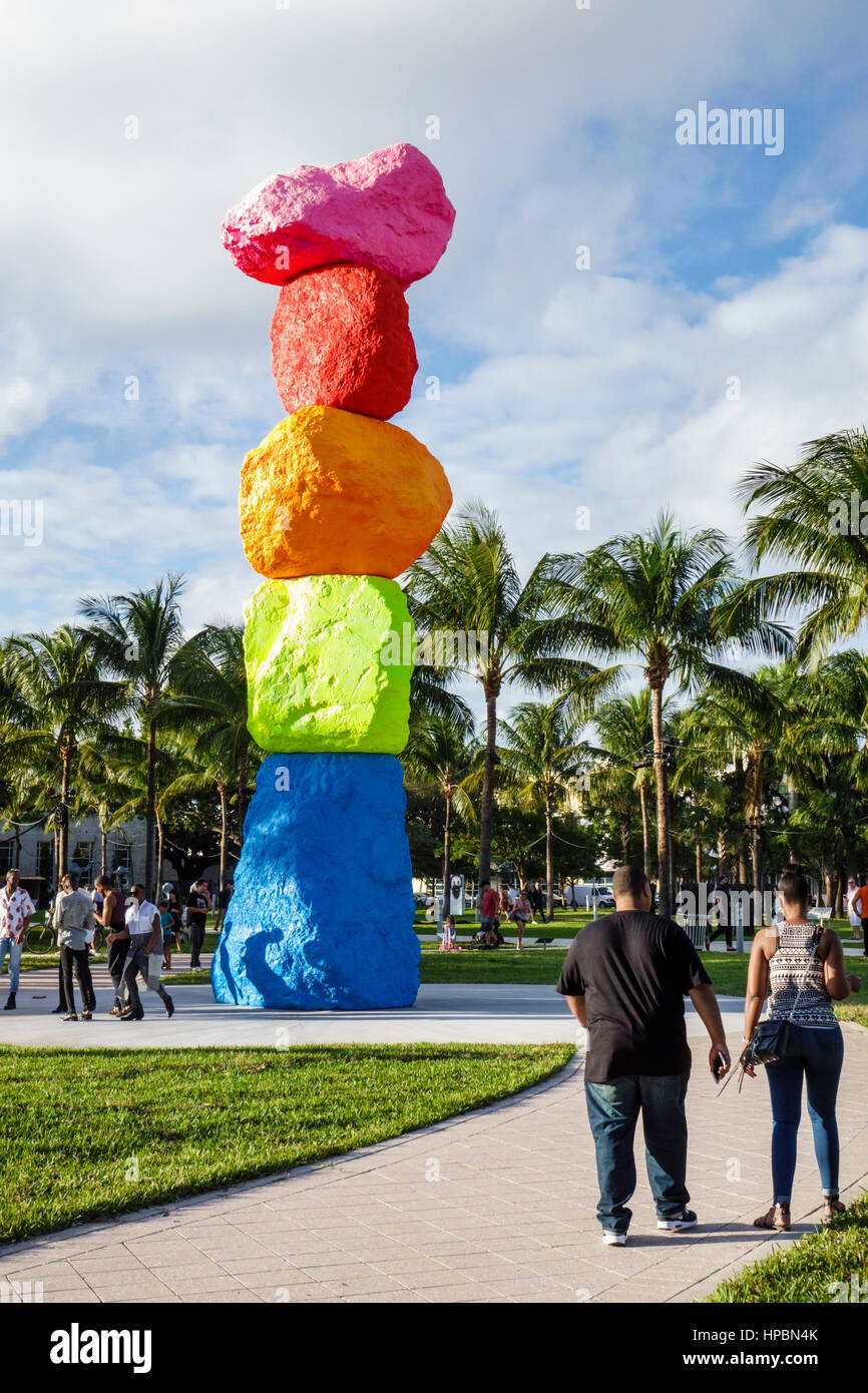 Miami Beach Florida,Collins Park,Art Basel,art fair,Public sector,outdoor sculpture,Miami Mountain,Ugo Rondinone,man men male,woman female women,walki Stock Photo