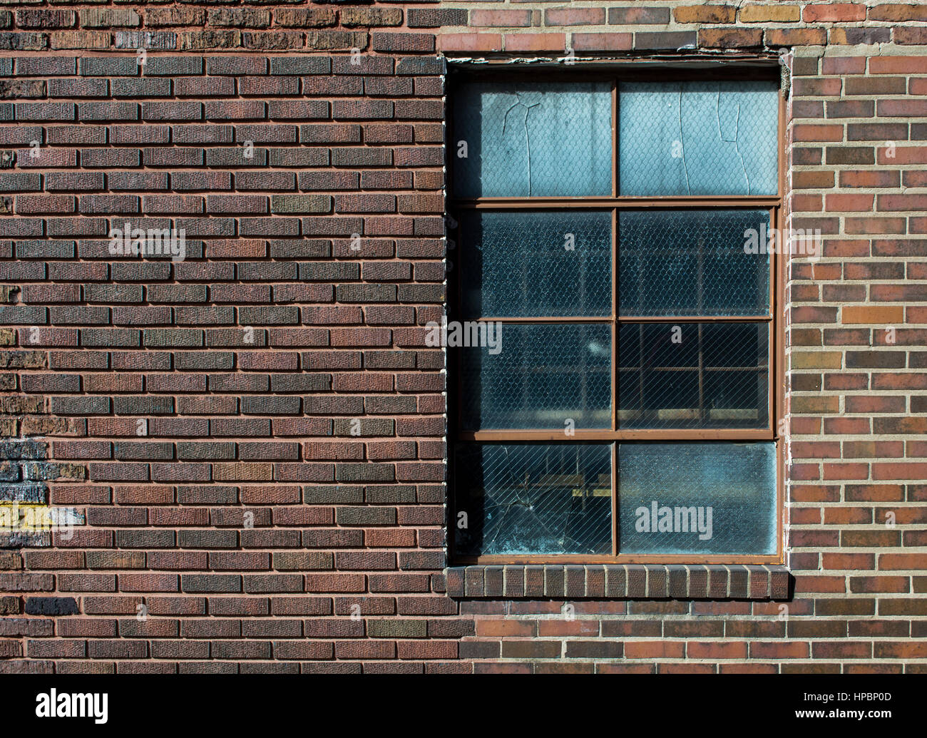 Brick wall with old broken window in natural light Stock Photo - Alamy