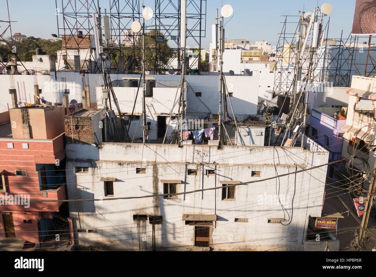 Cell Phone Towers on rooftop of a house Stock Photo