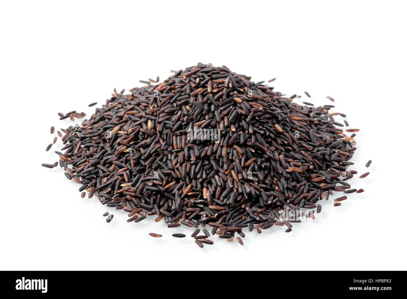 closeup details of Thai rice berry, rice berry is a cross-bred unmilled rice possessing dark violet grain and Thai Hom Mali Rice. Stock Photo