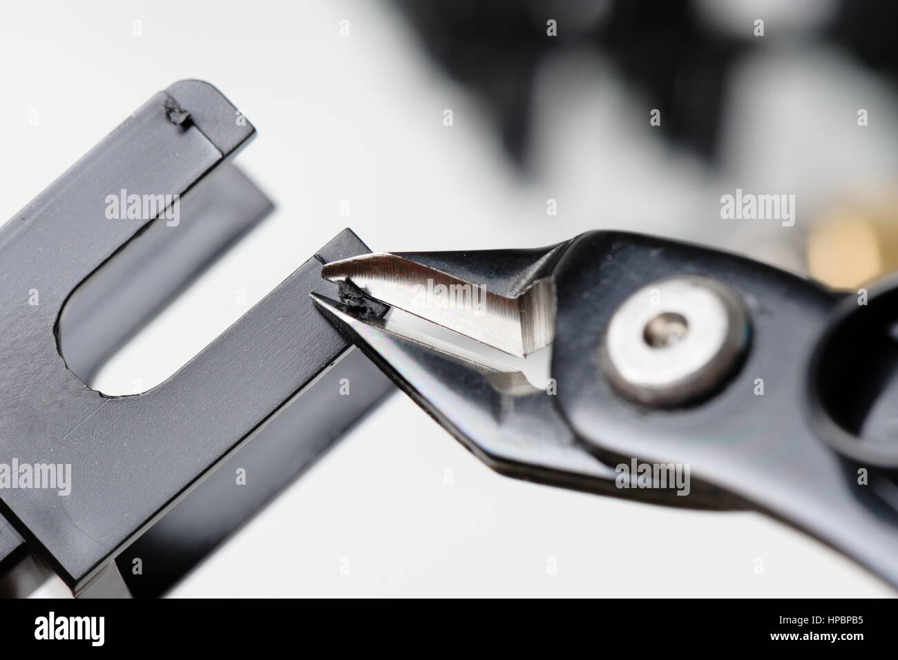 using plastic nippers cut the plastic injection molding parts Stock