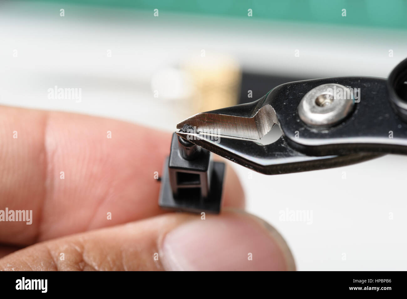 using plastic nippers cut the plastic injection molding parts Stock