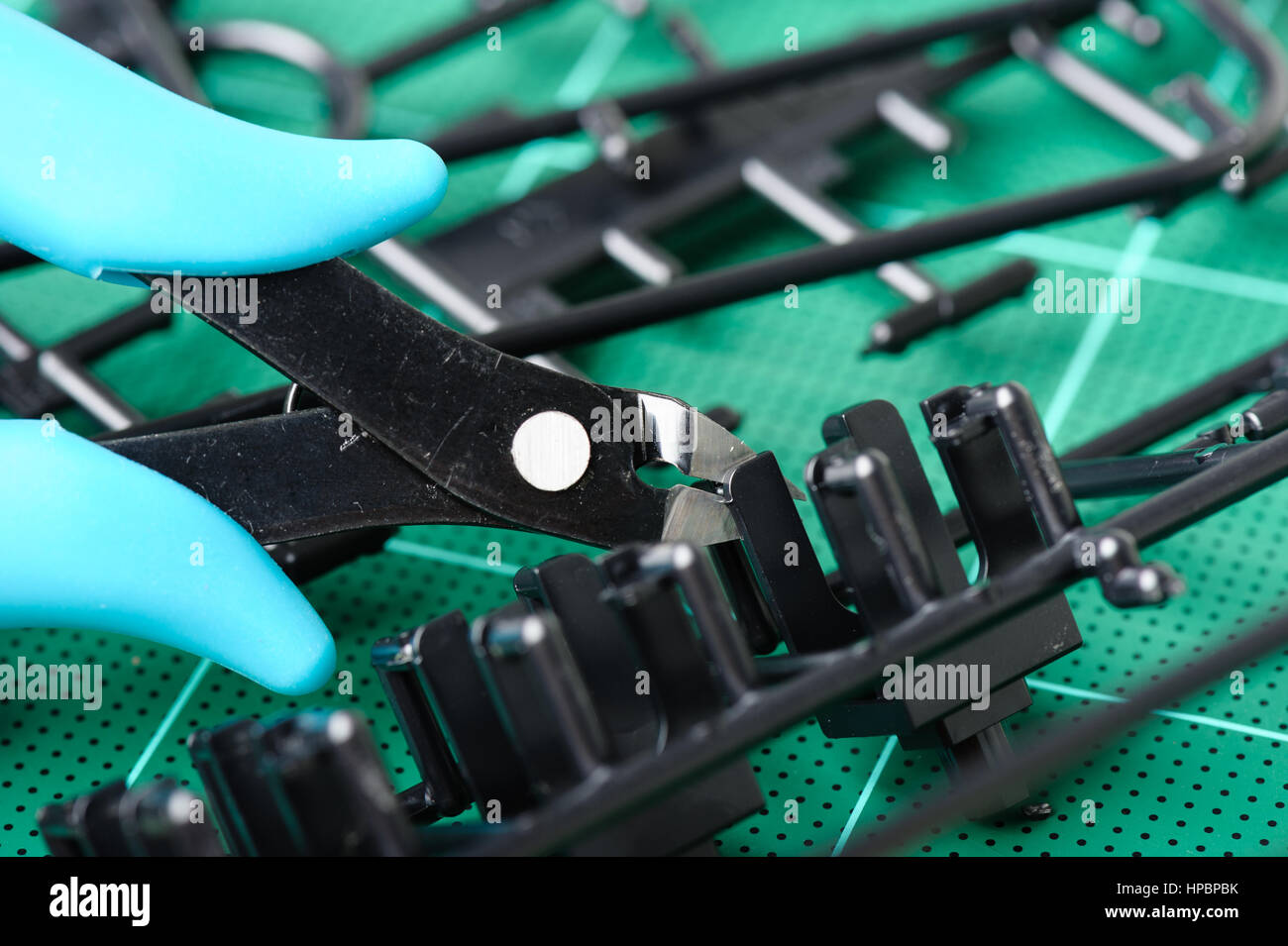 using plastic nippers cut the plastic injection molding parts Stock