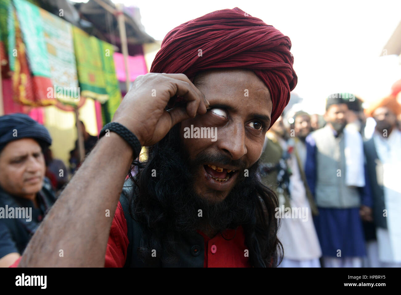 Sufi self-mortification practices at the annual 'Urs (death anniversary) of the Sufi saint Zinda Shah in Makanpur, Uttar Pradesh, India. Stock Photo