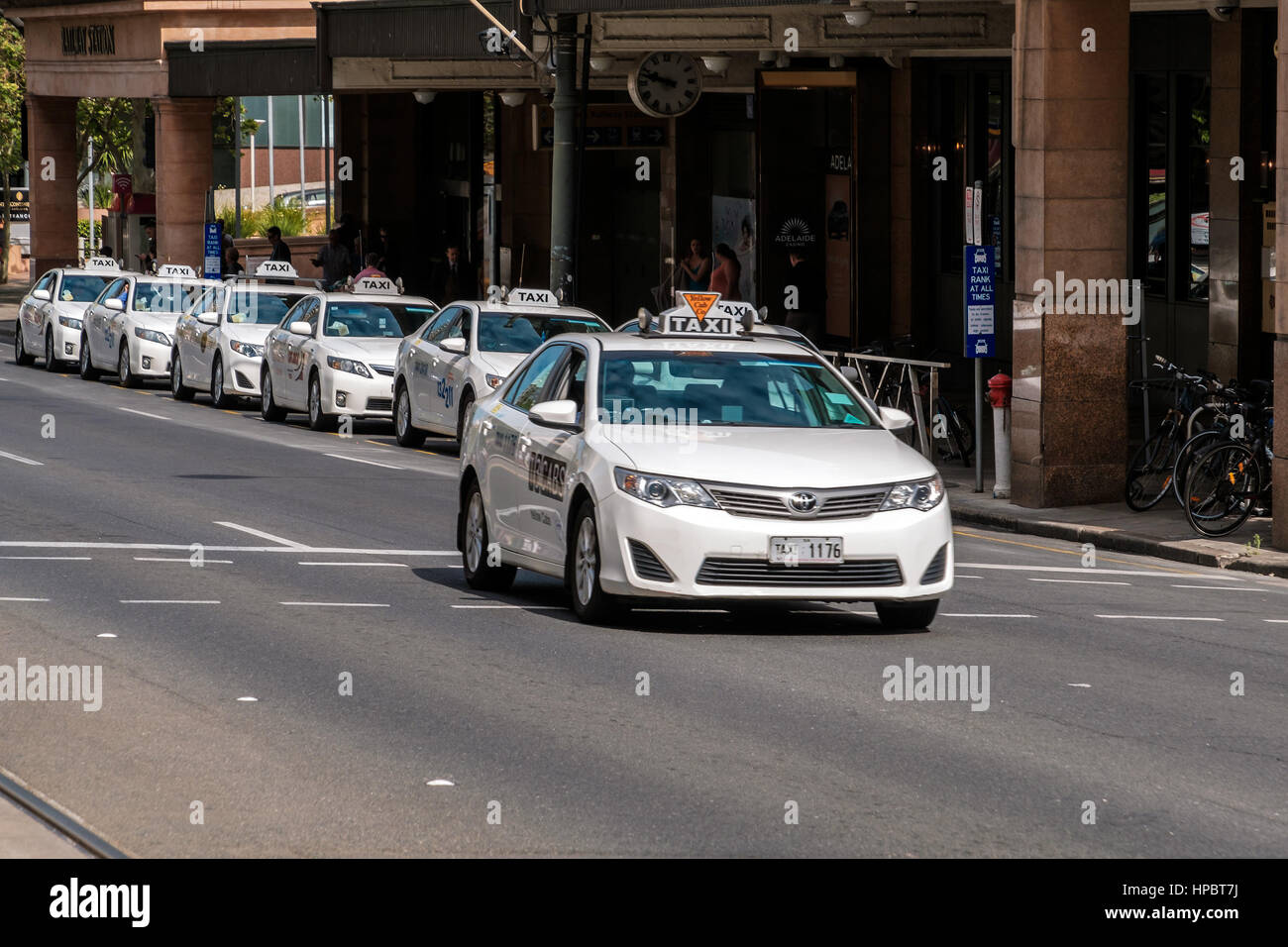 Adelaide, Australia - November 11, 2016: Taxi cars near Adelaide Railway Station viewed across the North Terrace on a day. Toyota Camry is the most po Stock Photo