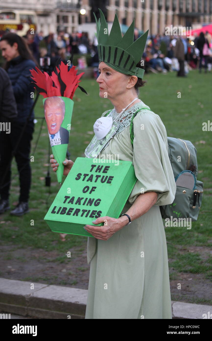 Westminster, London, UK. 20th Feb, 2017. A Stop Trump rally is held outside the UK Parliament, while inside MPs debate a petition signed by 1.8 million people calling for an invitation to the US president to visit the UK to be withdrawn. A woman dresses as 'the Statue of Taking Liberties.' Westminster, London, UK. Credit: Roland Ravenhill/Alamy Live News Stock Photo
