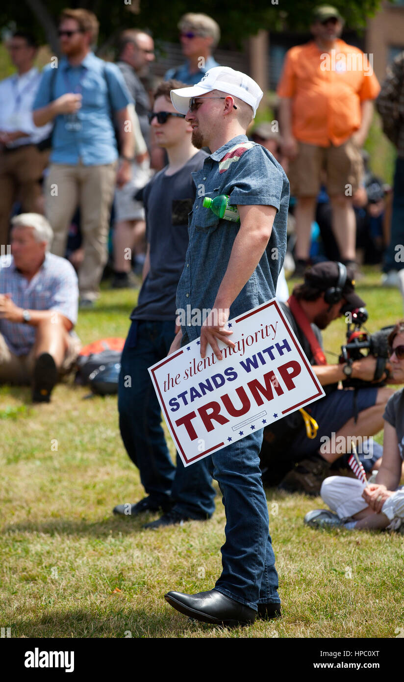 A Donald Trump supporter holds a sign during a rally outside of the Republican National Convention on July 18, 2016. Cleveland, Ohio, United States. Stock Photo