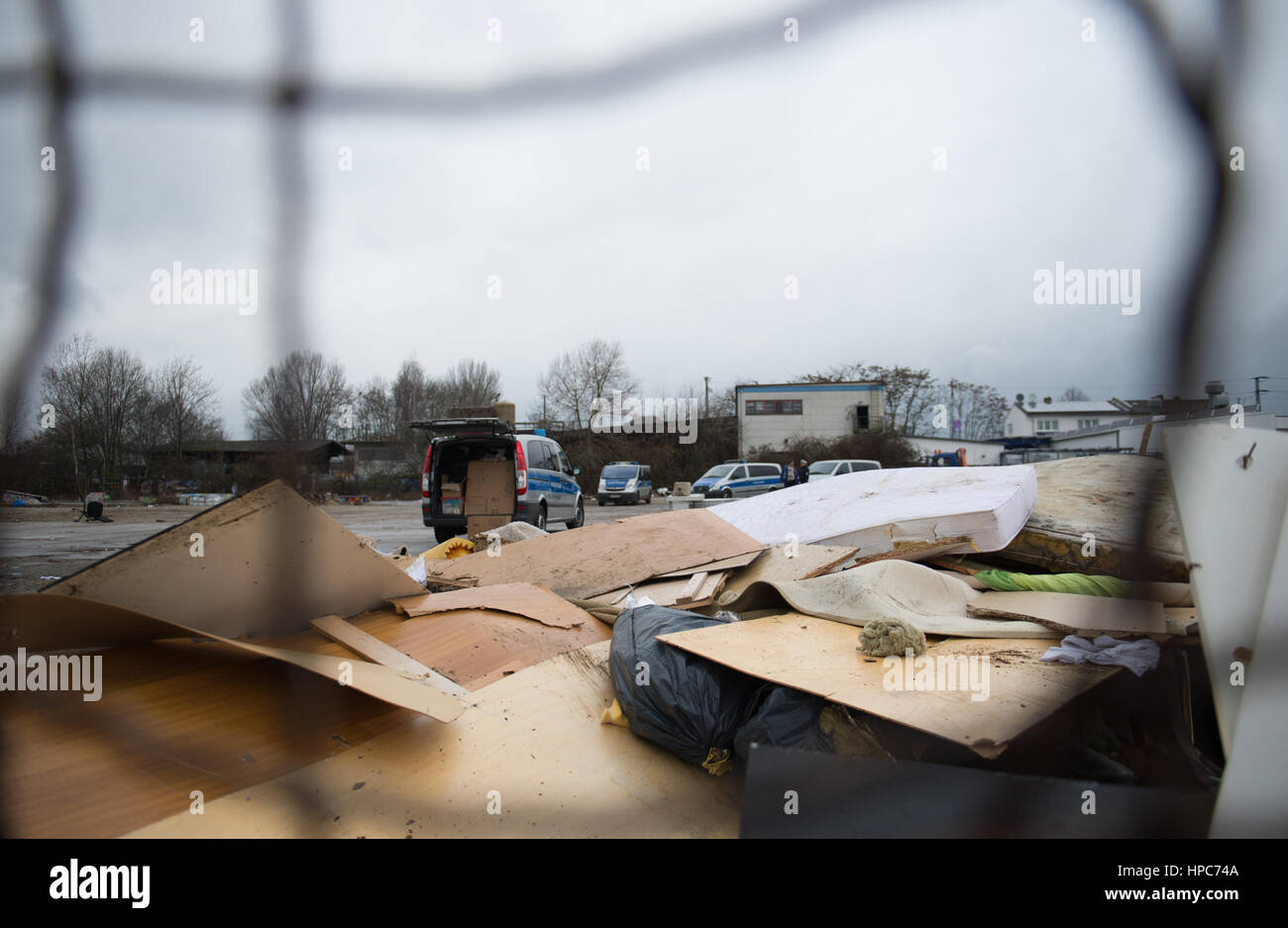 State police officers stand before the ruins of the handbuilt huts on a commercial property in the Gutleutviertel district on the outskirts of Frankfurt am Main, Germany, 21 February 2017. Several dozen Romanians were living in the wooden sheds. They were demolished. Photo: Susann Prautsch/dpa Stock Photo