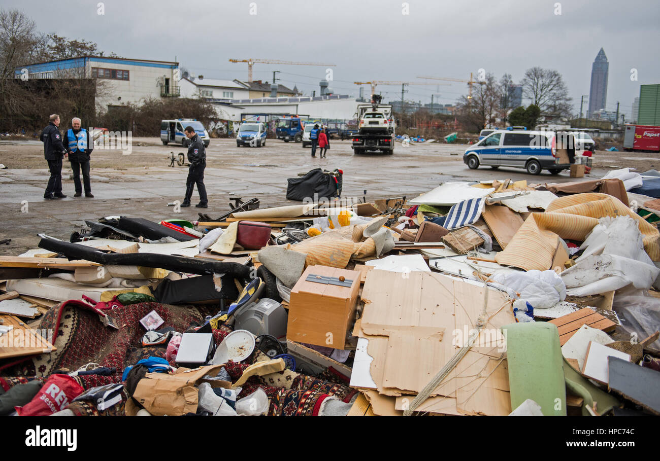 State police officers stand before the ruins of the handbuilt huts on a commercial property in the Gutleutviertel district on the outskirts of Frankfurt am Main, Germany, 21 February 2017. Several dozen Romanians were living in the wooden sheds. They were demolished. Photo: Susann Prautsch/dpa Stock Photo