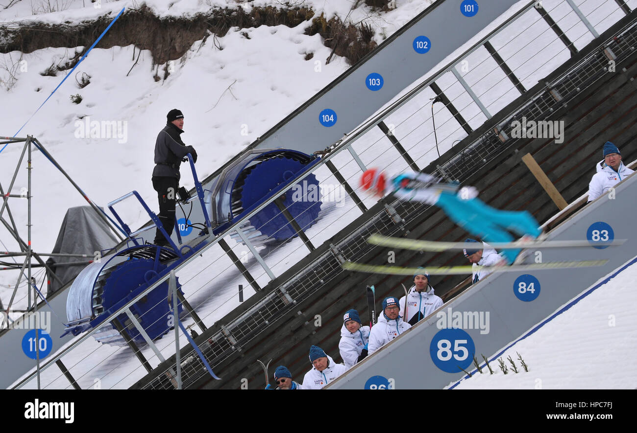 Lahti, Finland. 21st Feb, 2017. A helper works on the large ski jump with a roller ahead of the Nordic World Ski Championships in Lahti, Finland, 21 February 2017. The World Championships run from 22 February to 05 March 2017. Photo: Hendrik Schmidt/dpa-Zentralbild/dpa/Alamy Live News Stock Photo