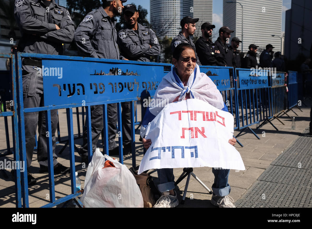 Tel Aviv, Israel. 21st February, 2017. Supporters of IDF Sgt. Elor Azaria, convicted of manslaughter in the March 2015 killing of Palestinian Abdel Fatah al Sharif as he lay wounded and helpless in Hebron,  demonstrate outside a military court in session at the IDF headquarters in Tel Aviv, as it hands down sentencing. Azaria was sentenced to 18 months imprisonment and demotion to private. Credit: Nir Alon/Alamy Live News Stock Photo