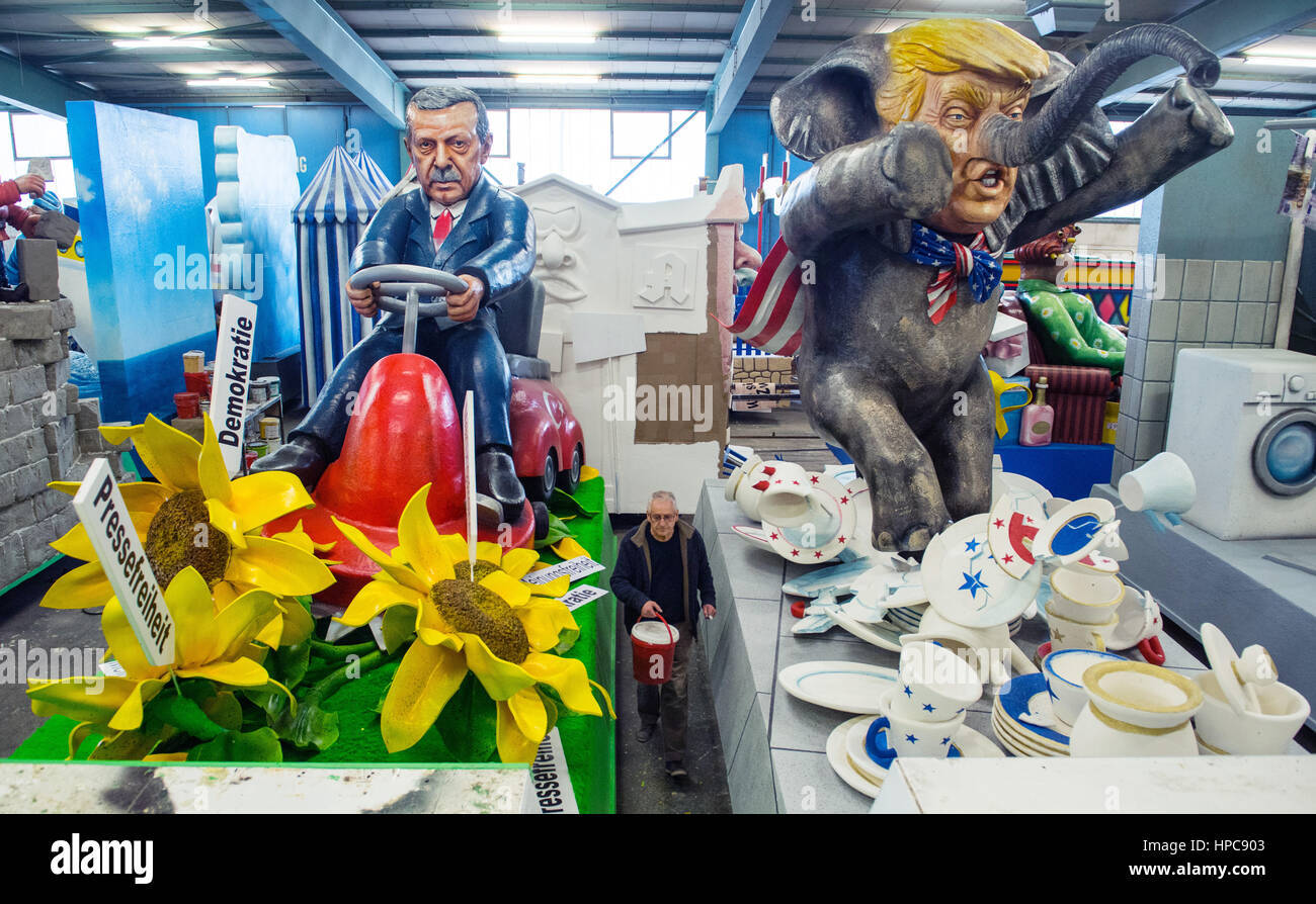 Mainz, Germany. 21st Feb, 2017. Two satirical carnival floats depict the Turkish president Recep Tayyip Erdogan (L) on a lawnmower mowing down flowers representing human rights, democracy and press freedom and the US president Donald Trump as the Republican Party equivalent of the proverbial bull in a china shop in Mainz, Germany, 21 February 2017. Photo: Andreas Arnold/dpa/Alamy Live News Stock Photo