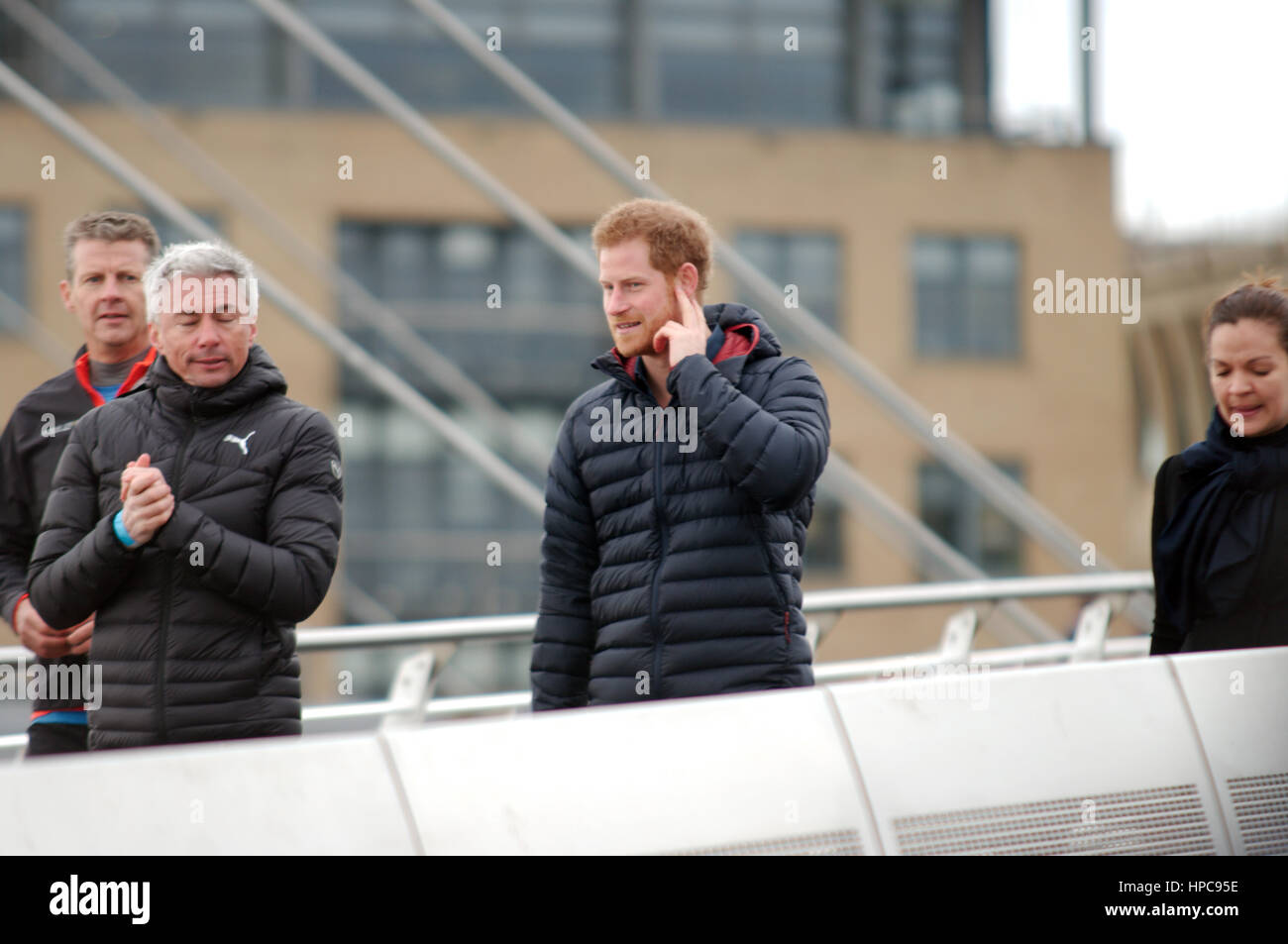 Gateshead, UK, 21st February 2017. Jonathan Edwards and Prince Harry walking across Millennium Bridge during his visit to Newcastle and Gateshead with Heads Together - Engagement 2 Credit: Colin Edwards/Alamy Live News Stock Photo