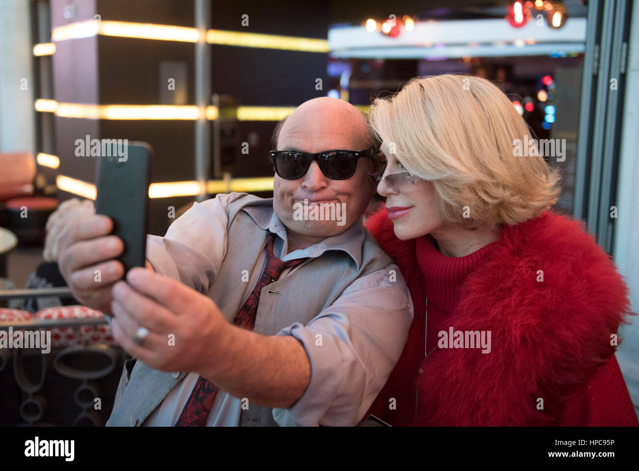Las Vegas, USA. 20th Feb, 2017.  Danny DeVito impersonator David Shadowens, left, takes a selfie with Joan Rivers impersonator Dee Dee Hanson on the red carpet prior to The Reel Awards at the Golden Nugget Hotel & Casino in Las Vegas, Nev., on February 20, 2017. The awards show is meant to be a humorous tribute to the Academy Awards.  Stock Photo