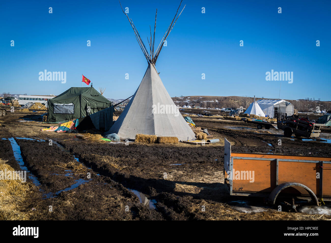 On February 20, 2017, water protectors in Standing Rock, North Dakota, continued their cleanup effort and attempted to negotiate an extension from being evicted from the Oceti Sakowin Camp, but were told by the Army Corps of Engineers that the notice of eviction would not change.  Hundreds of militarized law enforcement from various agencies, including The US National Guard and Homeland Security, will reportedly raid the camp at 2 p.m. on Wednesday, February 22, 2017 and will arrest all water protectors who refuse to leave.   Photo: Cronos/Michael Nigro Stock Photo