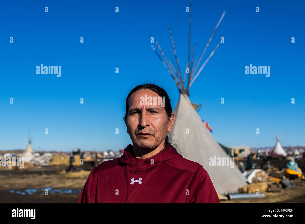 Charles W. Whalen of the Oglala Sioux Tribe, is one of the water protectors who says he will remain at the Oceti Sakowin Camp, citing that the pipeline is is being build on treaty land.  Hundreds of militarized law enforcement from various agencies, including The US National Guard and Homeland Security, will reportedly raid the camp at 2 p.m. on Wednesday, February 22, 2017 and will arrest all water protectors who refuse to leave.  Photo: Cronos/Michael Nigro Stock Photo