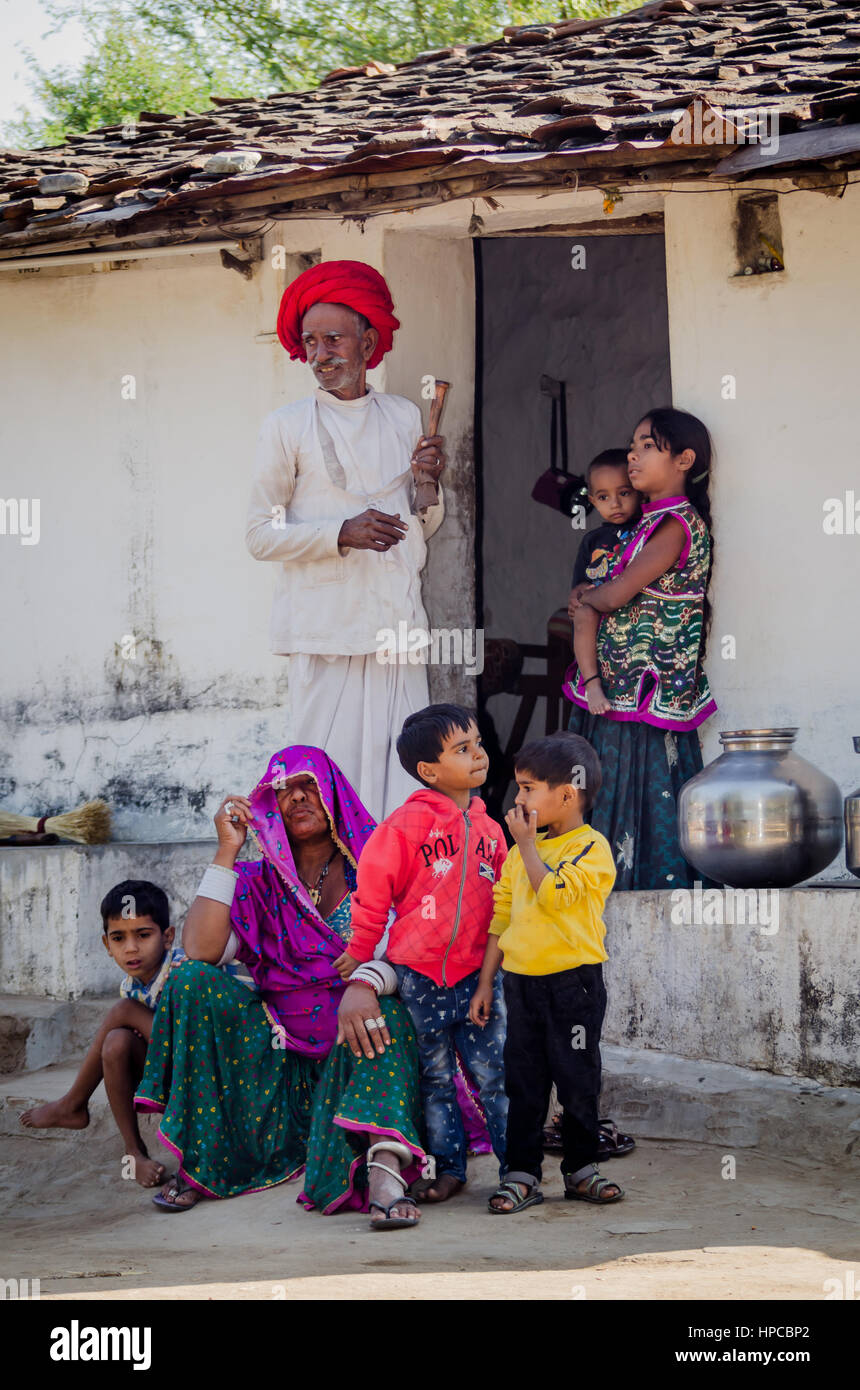 RAJASTHAN, INDIA - NOVEMBER 20, 2016: Five young grandchildren with their elderly grandparents when their parent is at work. Stock Photo