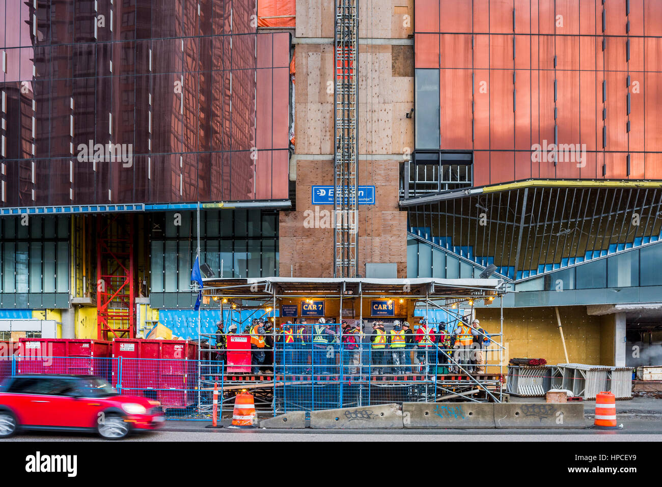 Construction workers wait for elevator at work site, Vancouver, British
