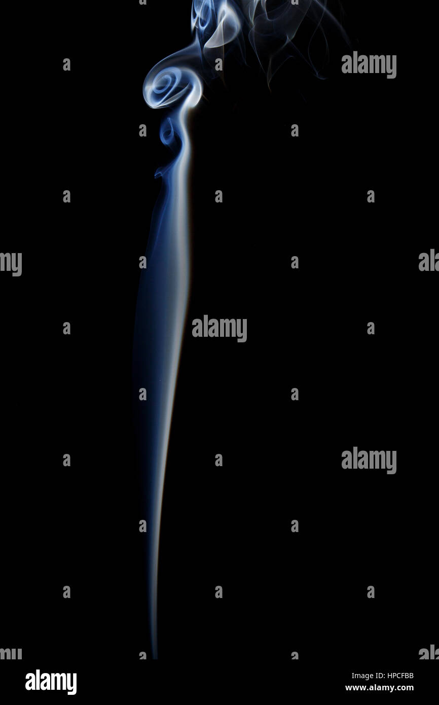 Abstract art. Color white blue smoke from the aromatic sticks on a