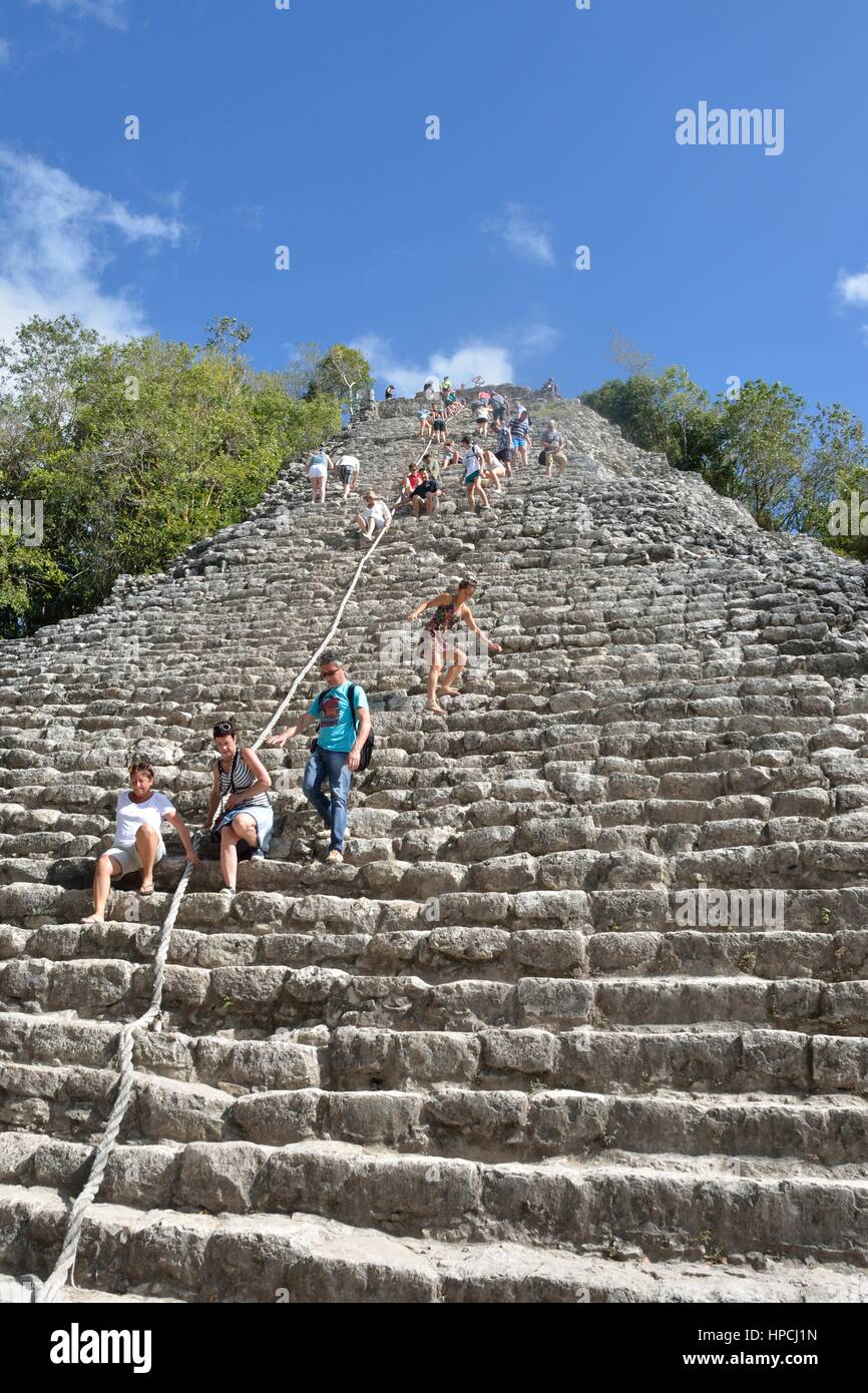 Coba  , Mexico - January  19, 2017: Tourists climbing Temple at Coba Yucatan Mexico Stock Photo