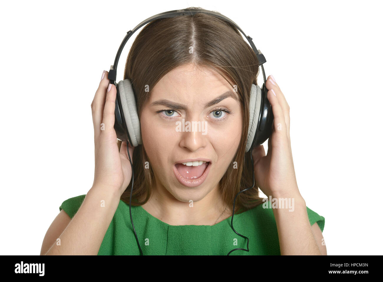 Happy beautiful girl listening to music in headphones Stock Photo - Alamy