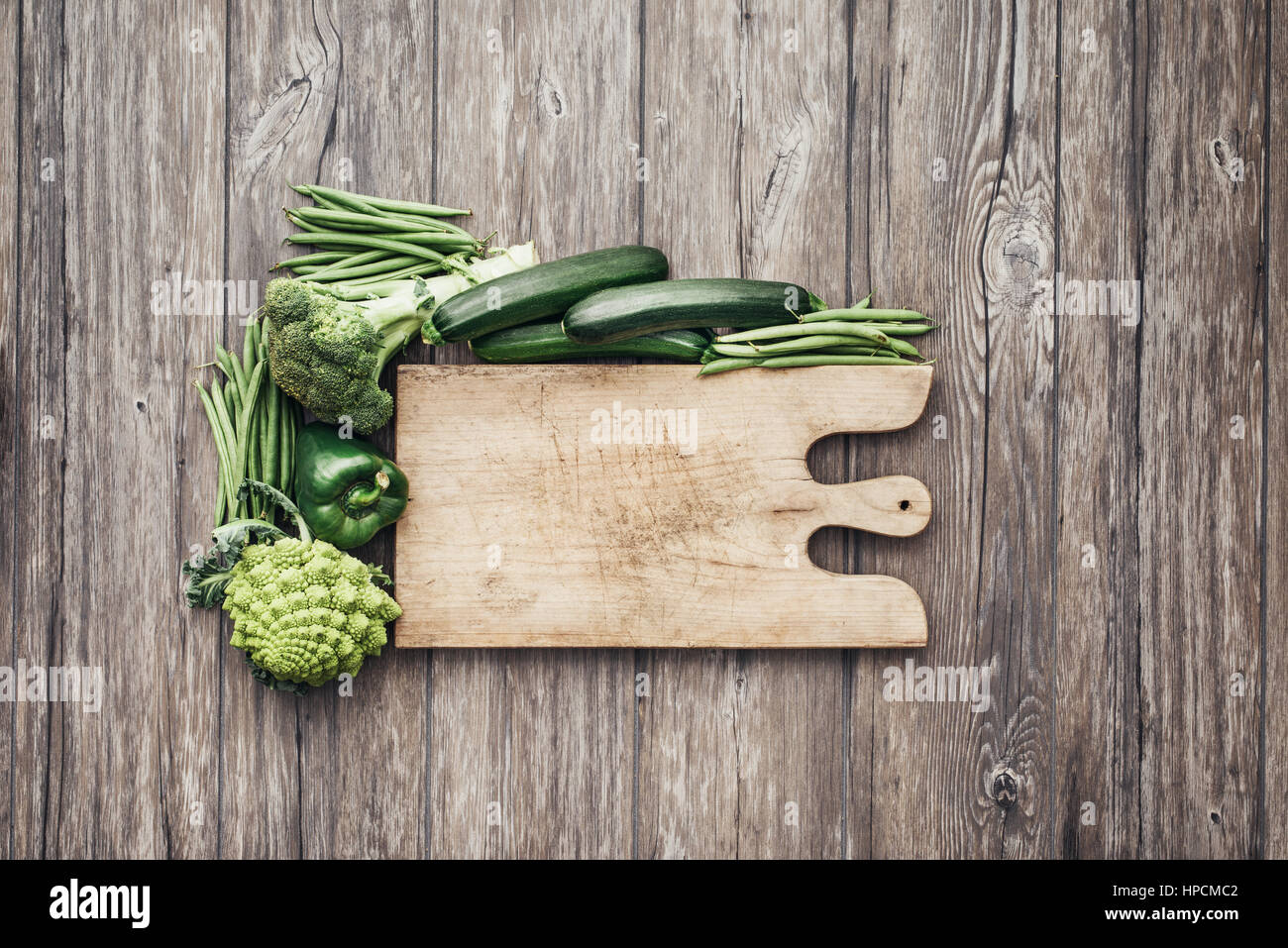 Chef Knife on Wooden Chopping Board with Fresh Vegetables Background.  Healthy Eating Concept. Vegetarian Raw Food Stock Photo - Alamy