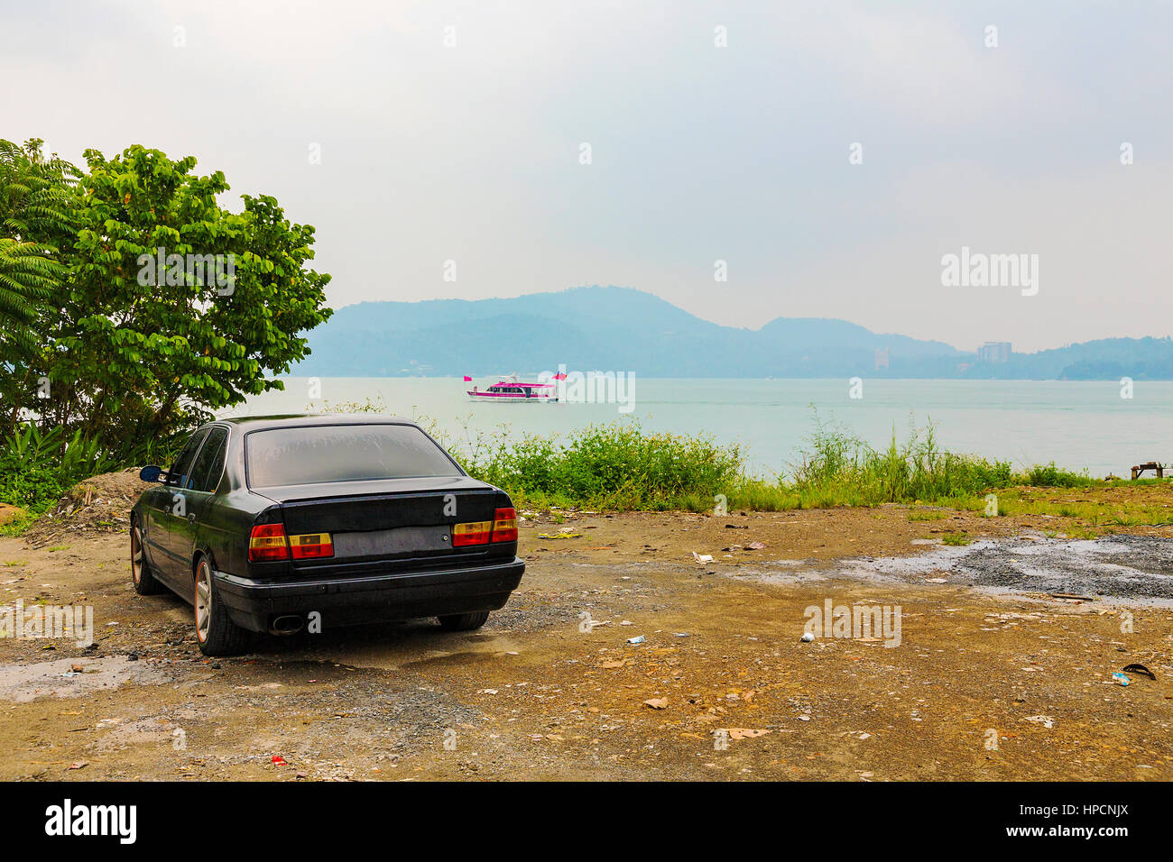 Old car by a lake in Taiwan Stock Photo