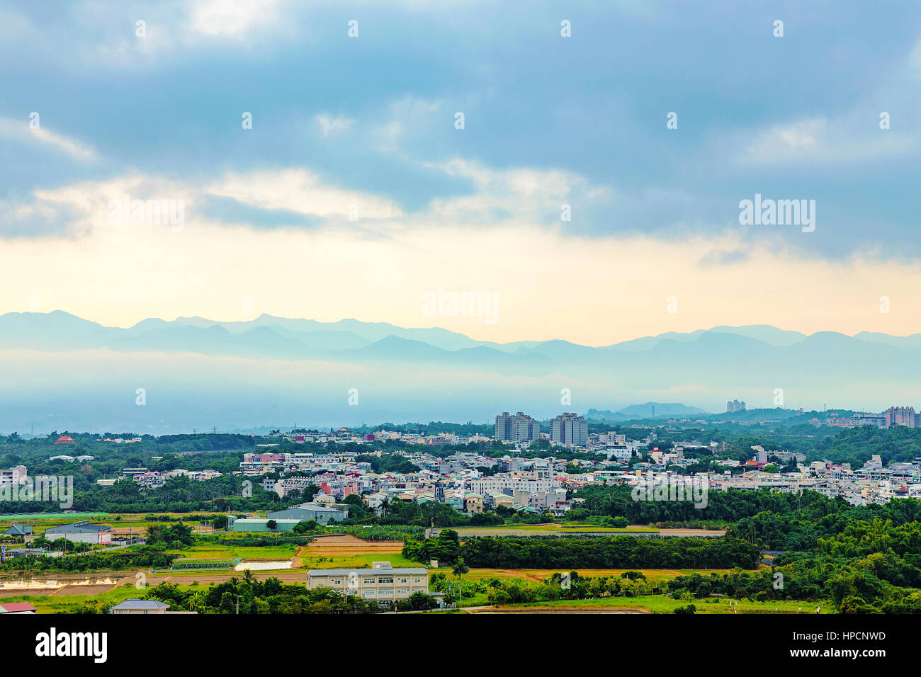 Chiayi Taiwan at dawn with mountain silhouette in the background Stock Photo