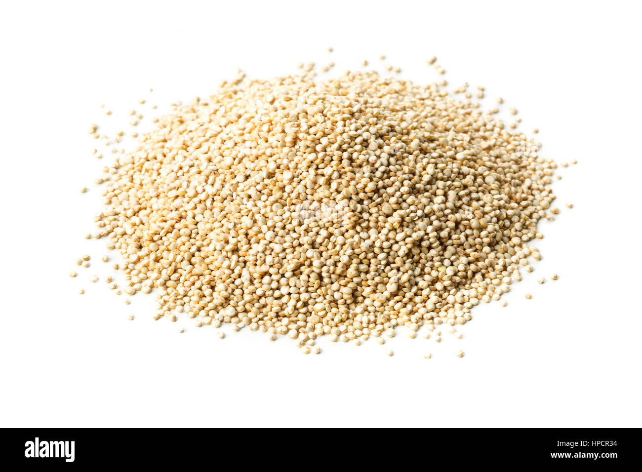 Heap of raw, uncooked quinoa seed on white background Stock Photo