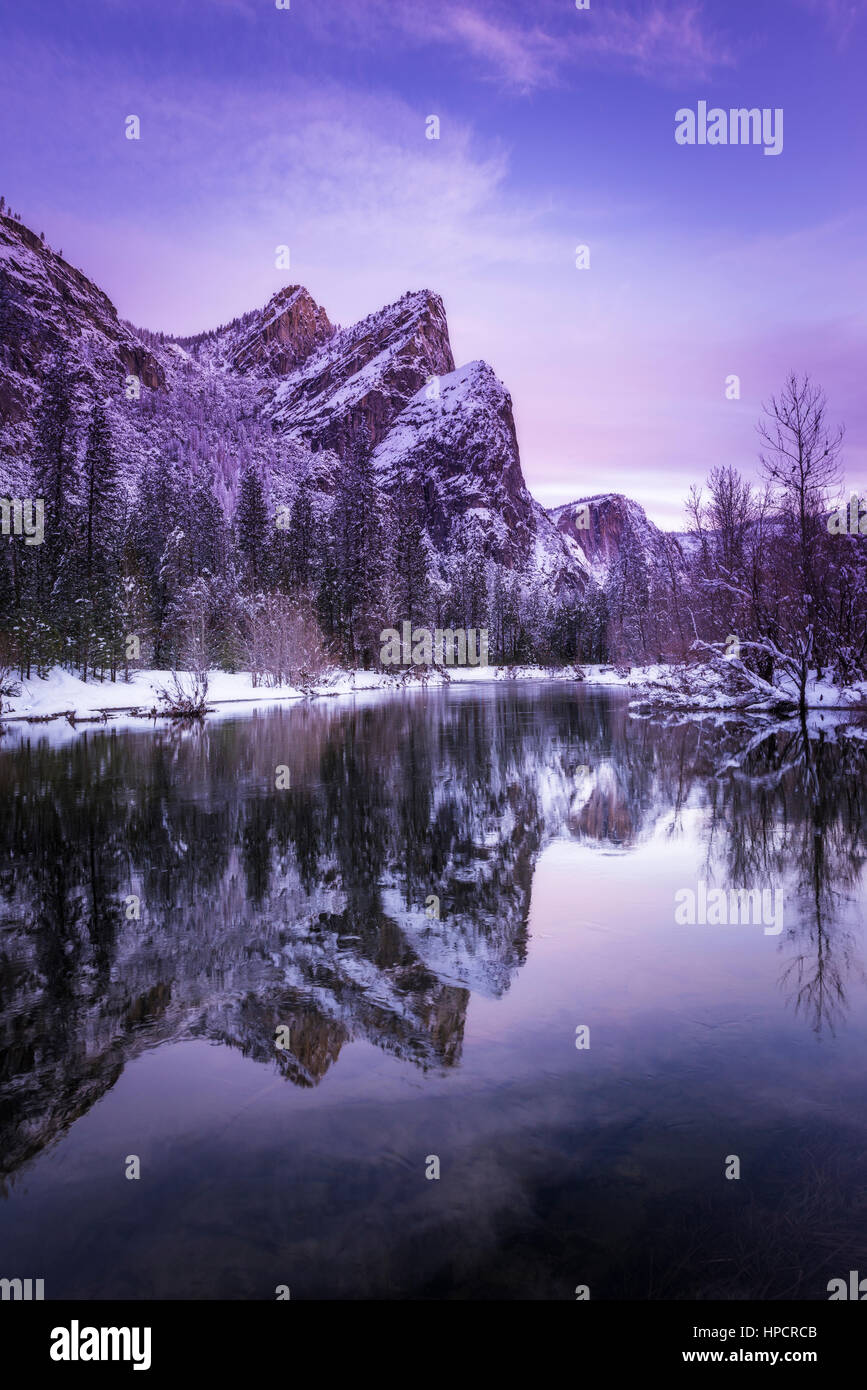 The Three Brothers above the Merced River in winter, Yosemite National Park, California USA Stock Photo