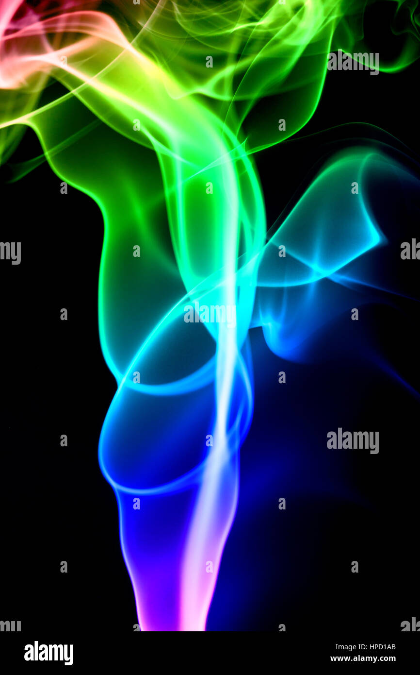 Colored smoke isolated on a black background Stock Photo - Alamy