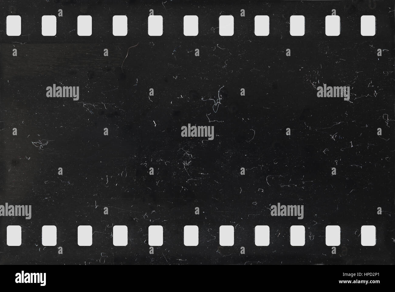 Strip of old celluloid film with dust and scratches - negative