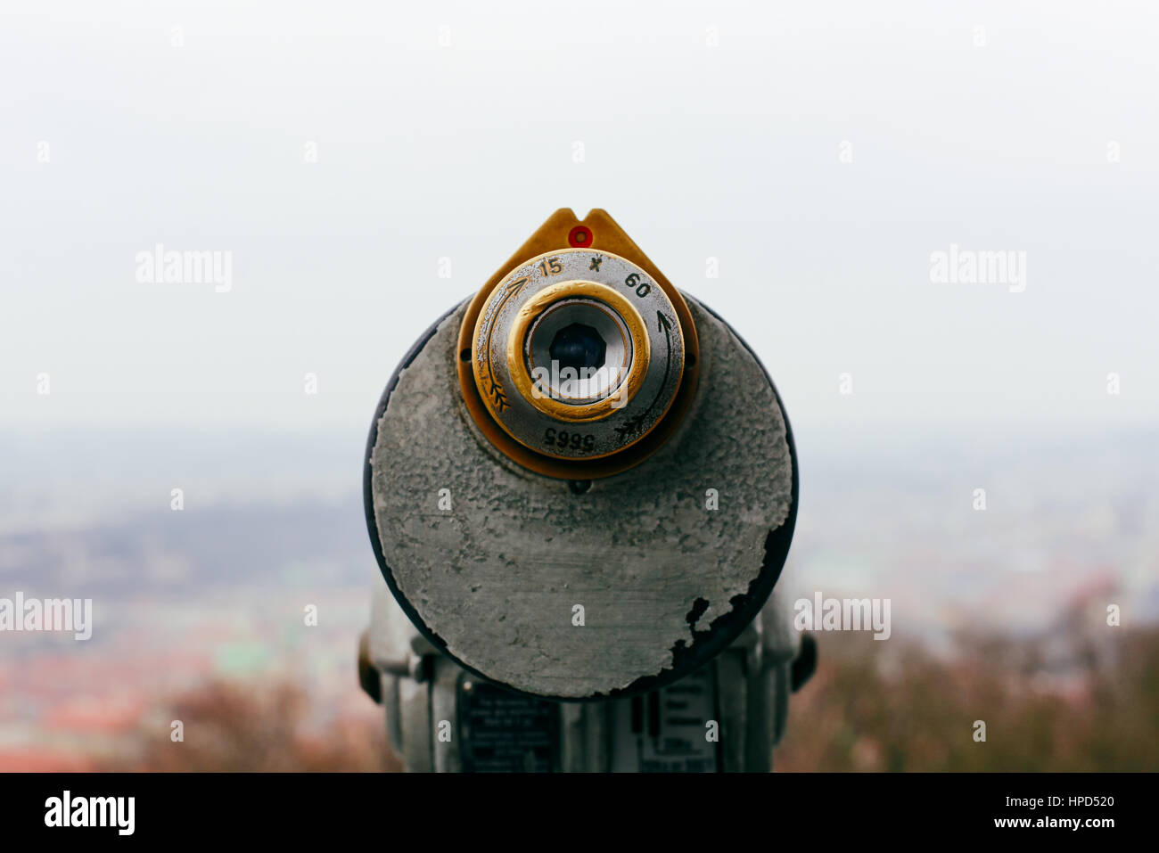 Coin operated binoculars on the viewing platform at Petrin Observation Tower, Prague, Czech Republic with the blurred city background. Stock Photo