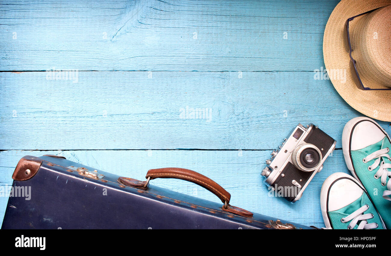 Old retro vintage suitcase and camera tourism travel background concept Stock Photo