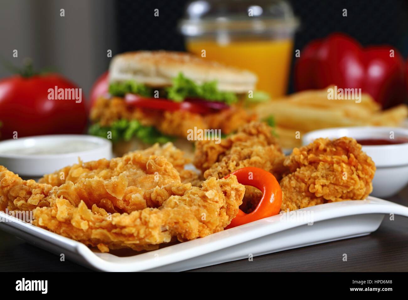 Breaded chicken strips sauces tomatoes hires stock photography and
