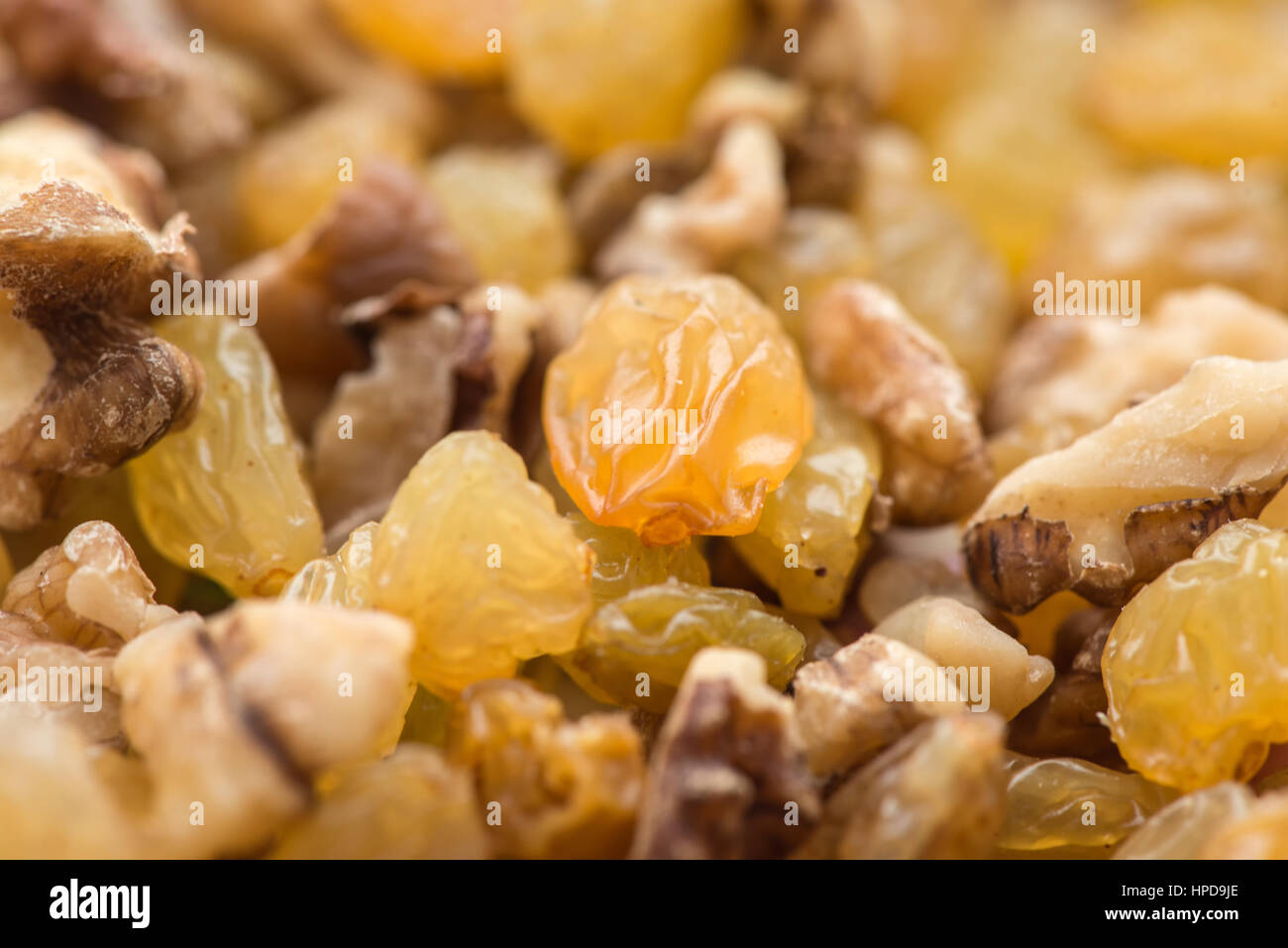 raisins and walnuts closeup background Stock Photo