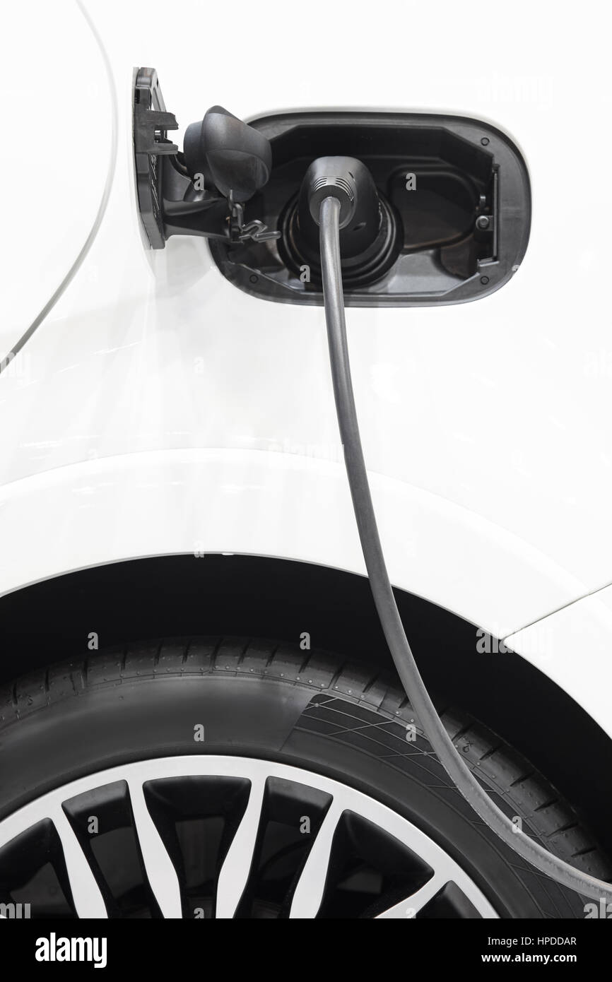 Electric car charging detail. Green and renewable energy technology ...