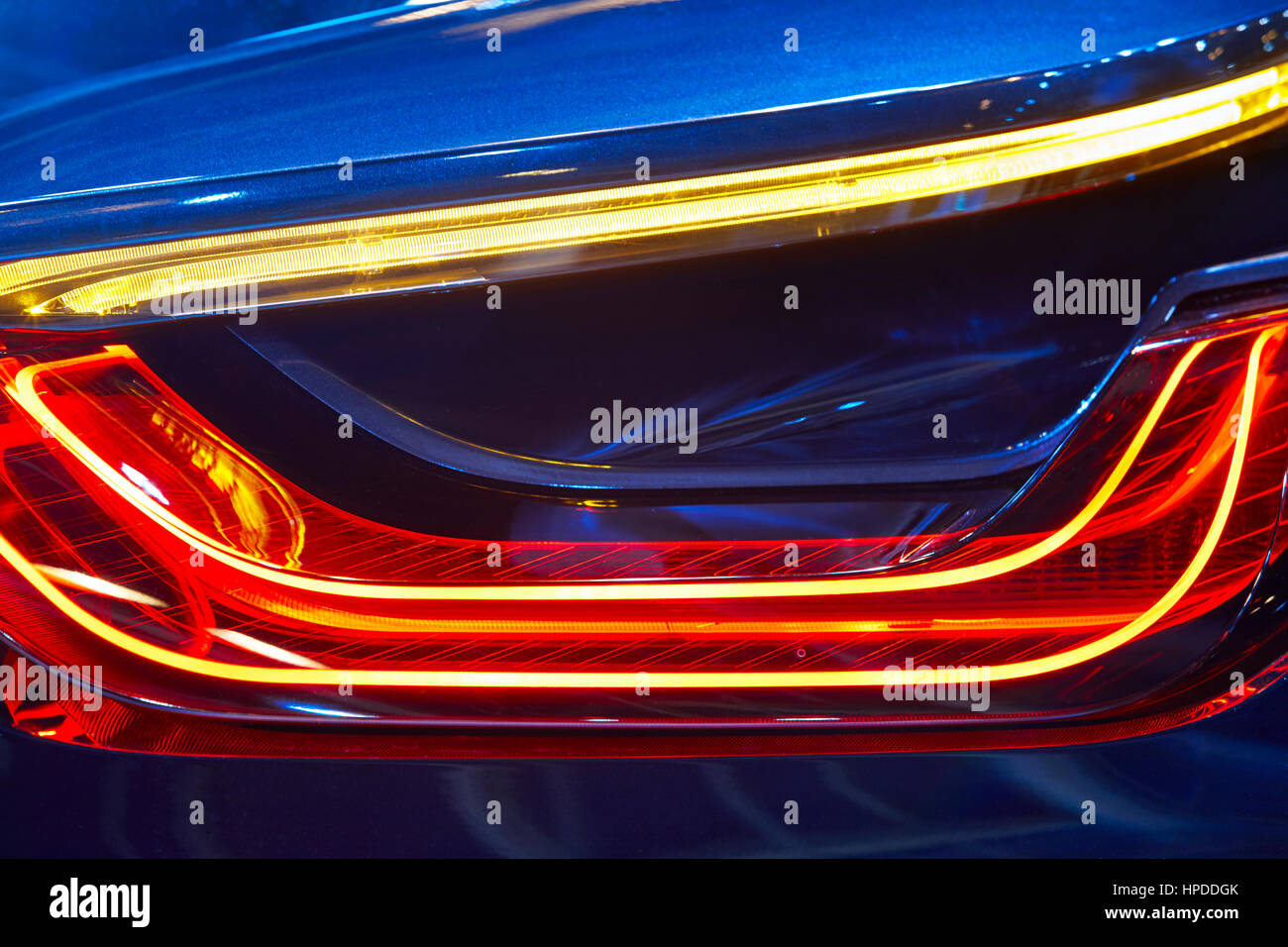 Rear car light detail in blue red tone. Vehicle part. Horizontal Stock