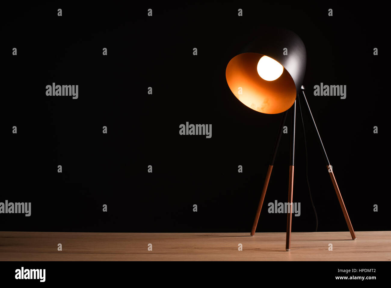 Desk lamp on empty wooden office table as space for text or product placement Stock Photo