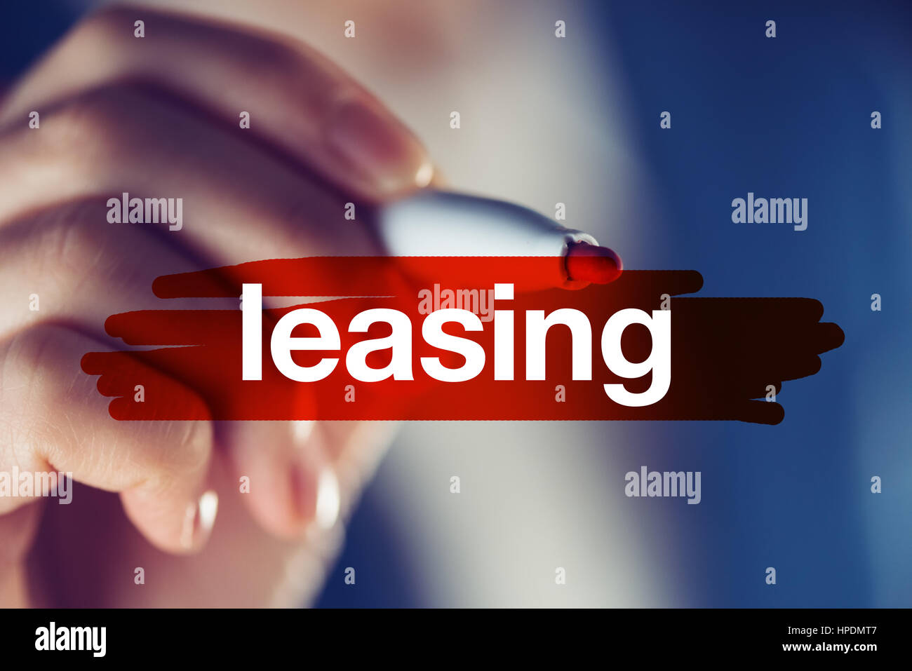 Leasing, business concept - businesswoman highlighting word with red marker pen Stock Photo