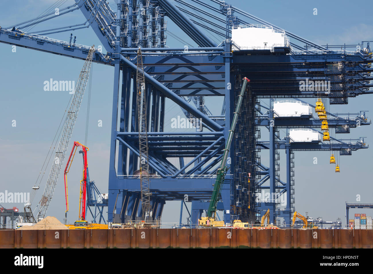 A close up view of some of the giant cranes used for loading and ...