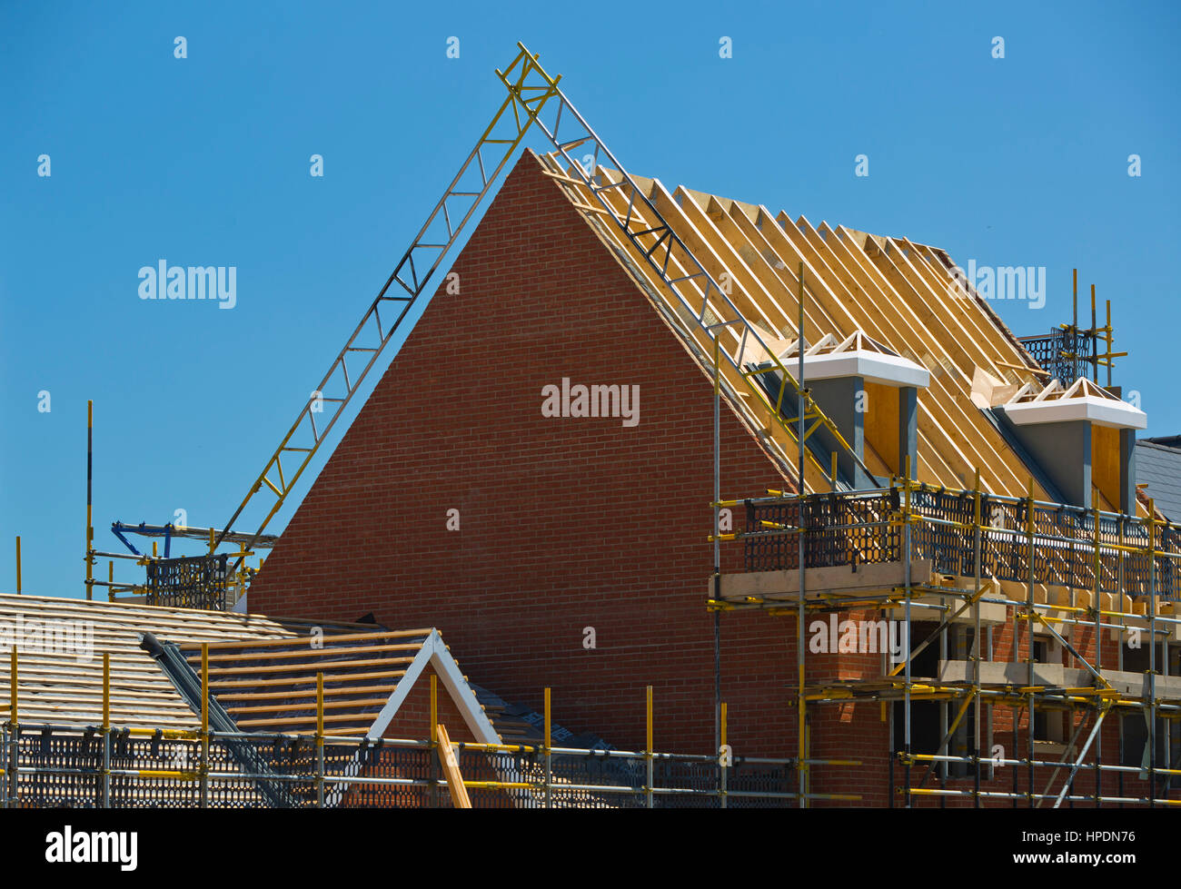 New Housing Development With Roofs Under Construction Showing