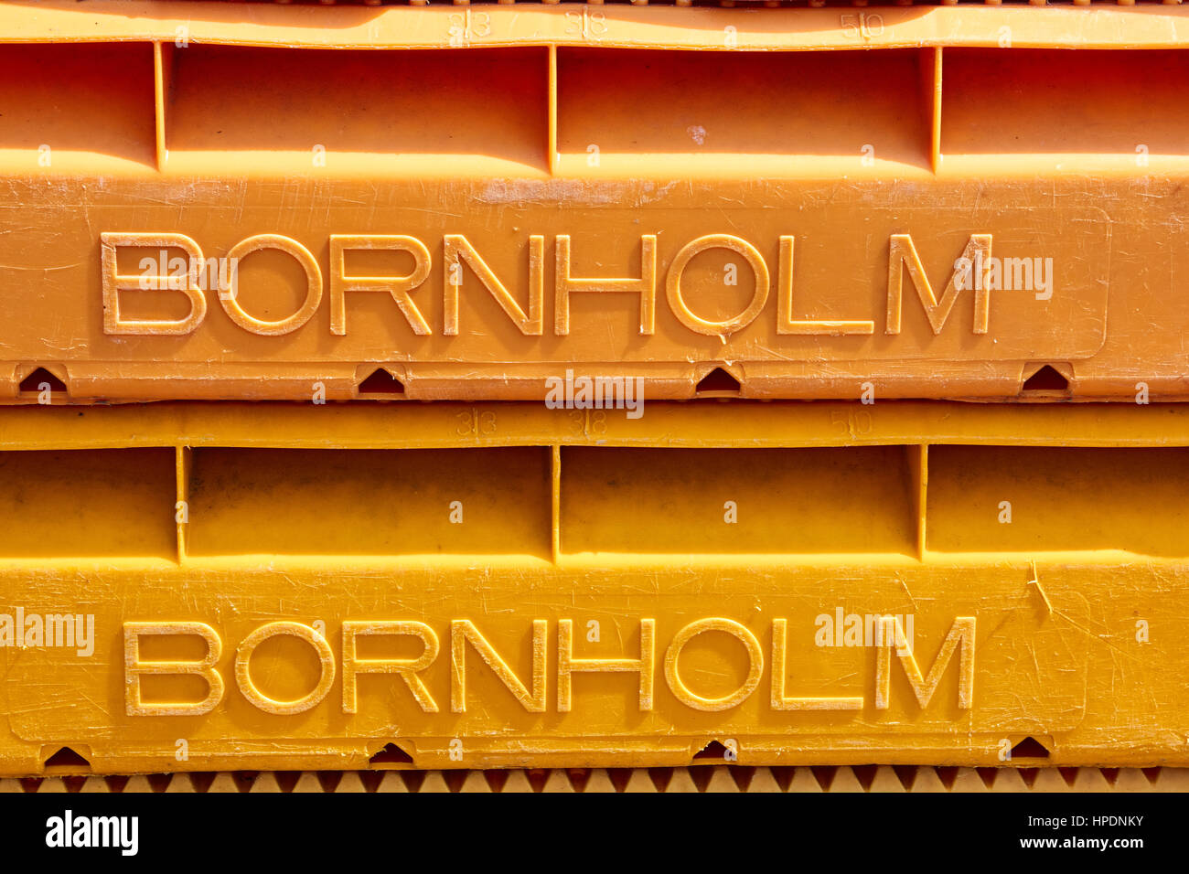 Section of two plastic fish crates with the text Bornholm  raised from the surface. Bornholm is the name of the Island - not a company Stock Photo